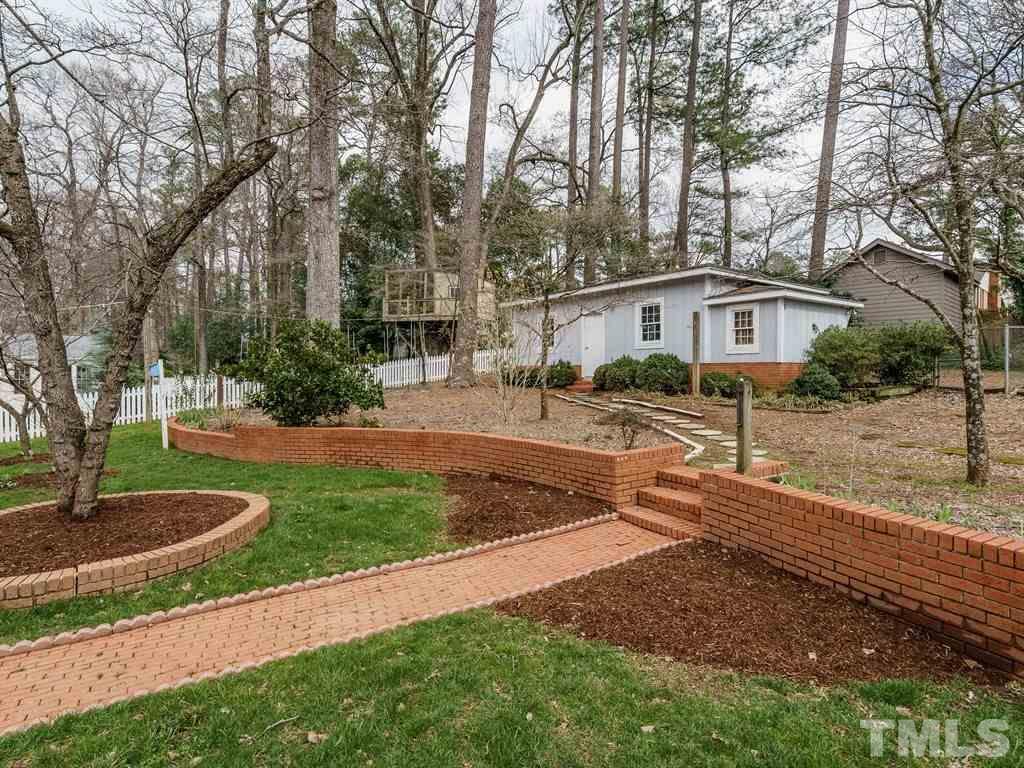 2456 Oxford Road Raleigh, NC 27608 - Photo 25 of 30 a view of a yard in front of a house