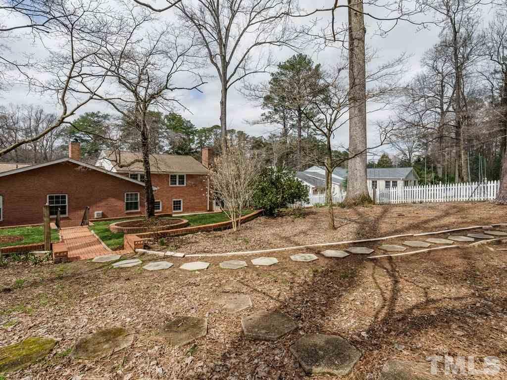 2456 Oxford Road Raleigh, NC 27608 - Photo 28 of 30 a view of a house with a yard covered in snow