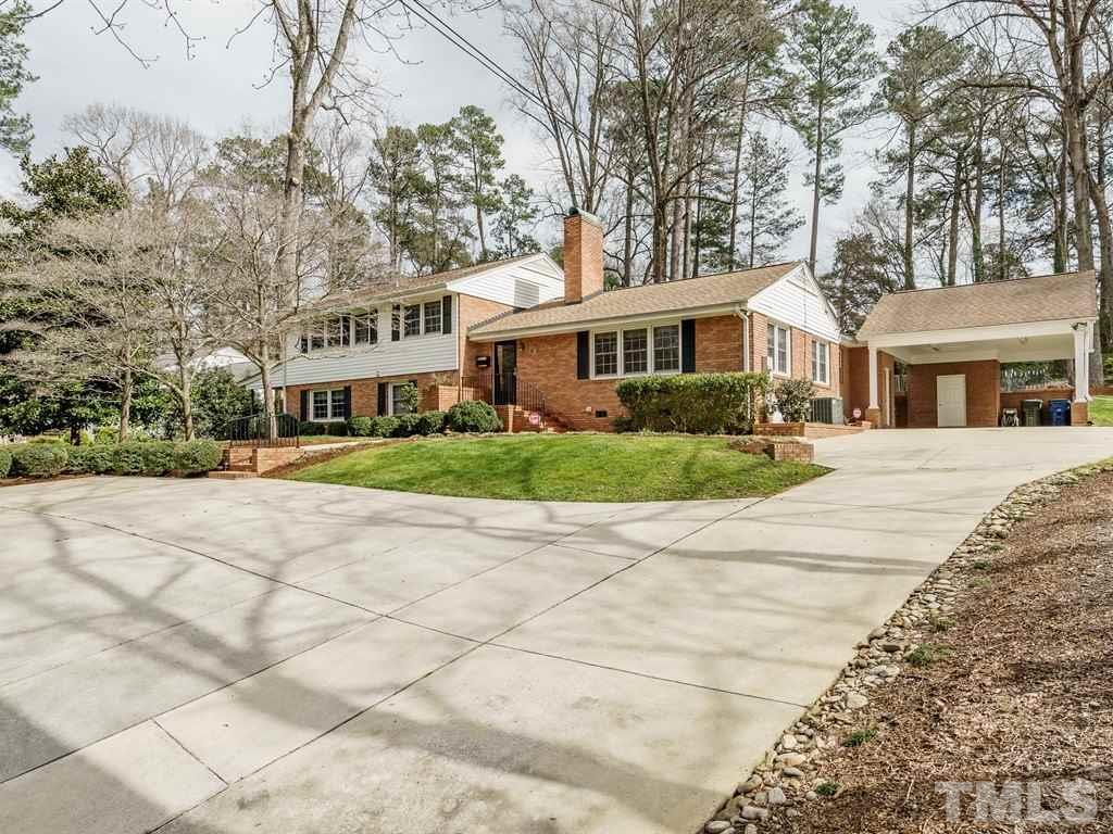 2456 Oxford Road Raleigh, NC 27608 - Photo 30 of 30 a front view of a house with a yard and potted plants