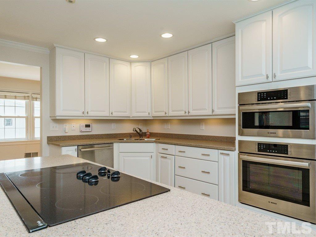 2456 Oxford Road Raleigh, NC 27608 - Photo 9 of 30 a kitchen with appliances a sink and cabinets