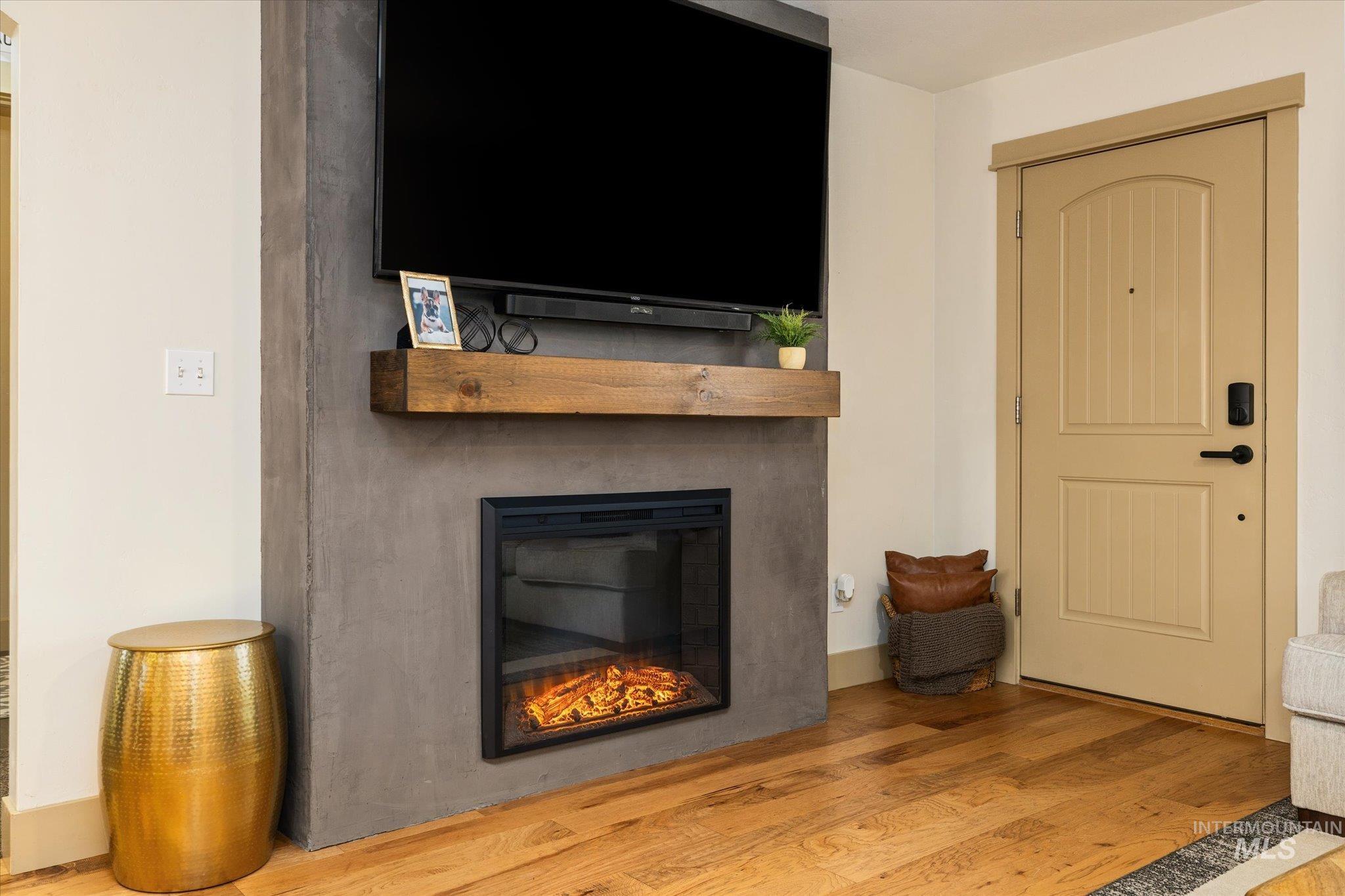 1065 West 11th Street Weiser, ID 83672 - Photo 11 of 48 Living room featuring light wood-style flooring and a glass covered fireplace