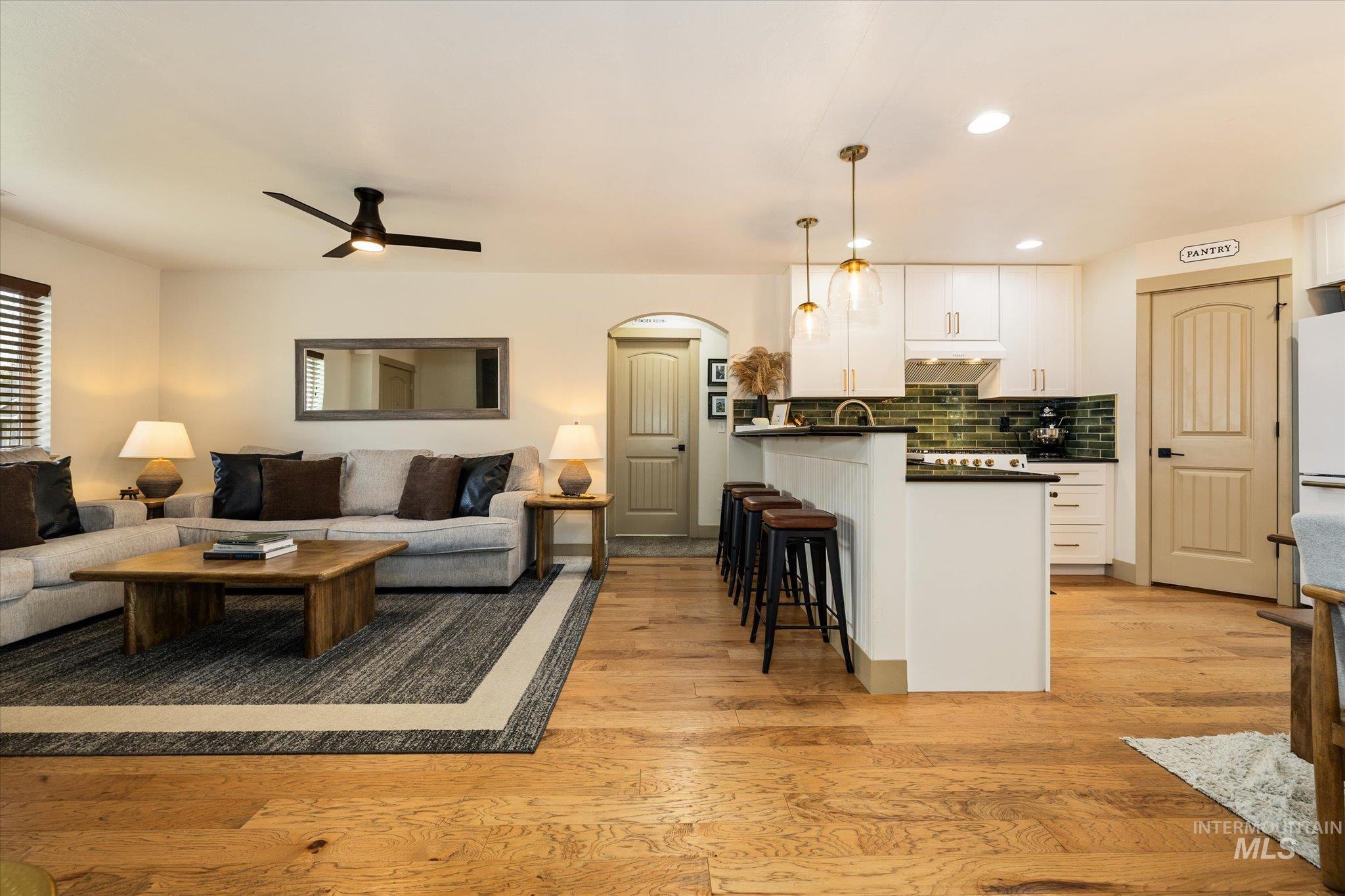 1065 West 11th Street Weiser, ID 83672 - Photo 15 of 48 Living area featuring light wood-type flooring, ceiling fan, arched walkways, and recessed lighting