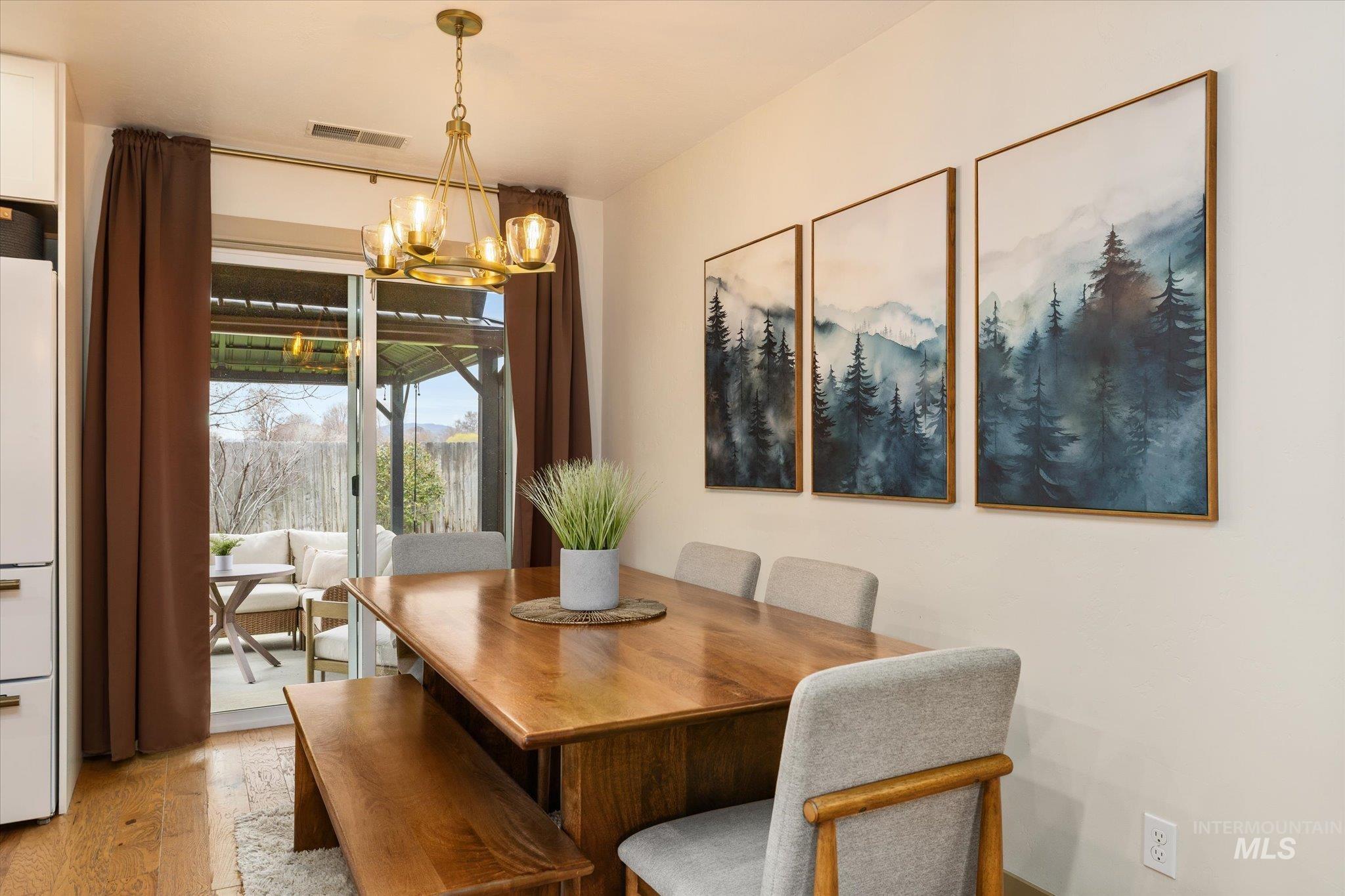 1065 West 11th Street Weiser, ID 83672 - Photo 17 of 48 Dining area with a chandelier and light wood-style floors