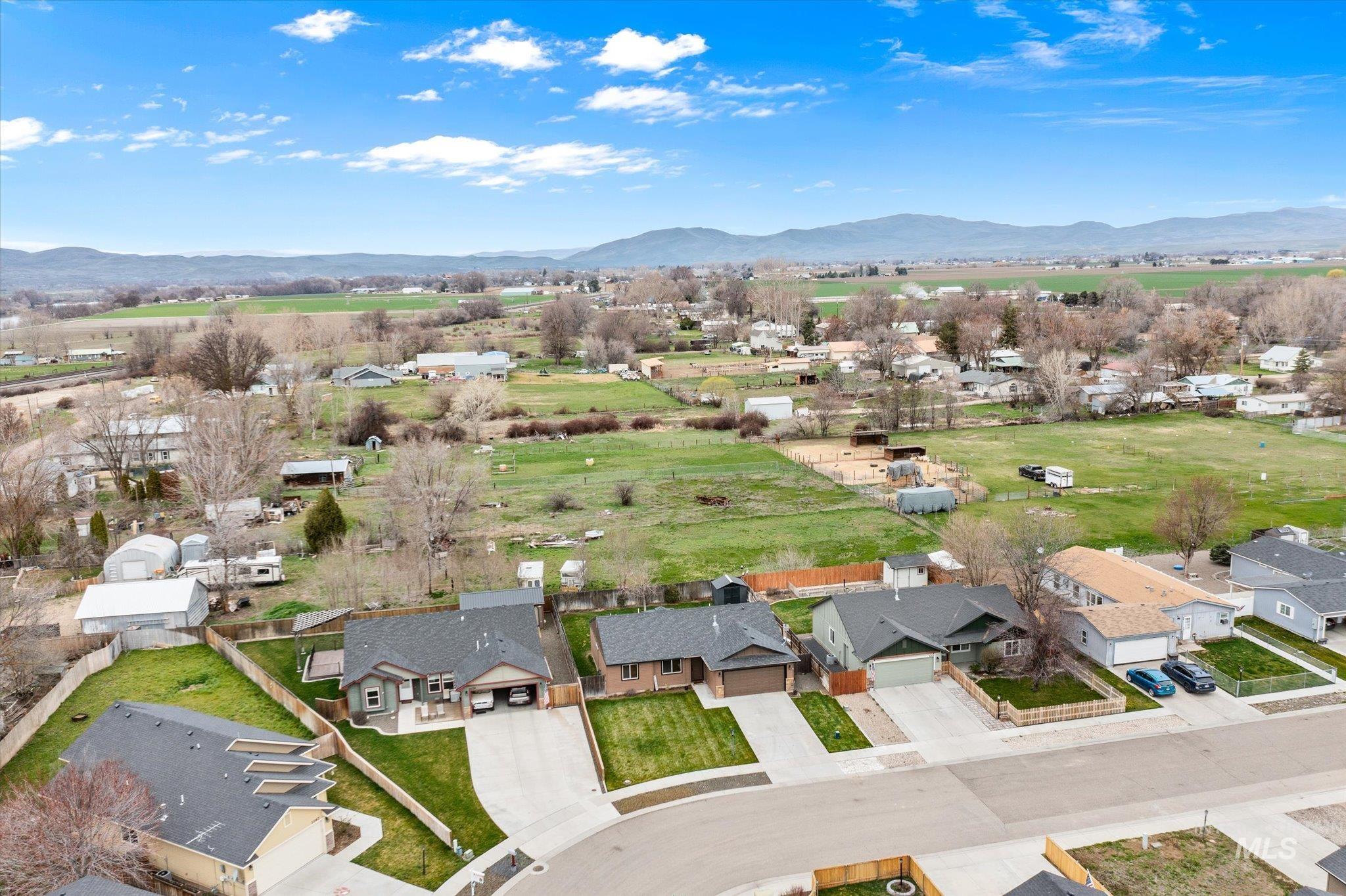 1065 West 11th Street Weiser, ID 83672 - Photo 2 of 48 Aerial view of residential area with a mountainous background