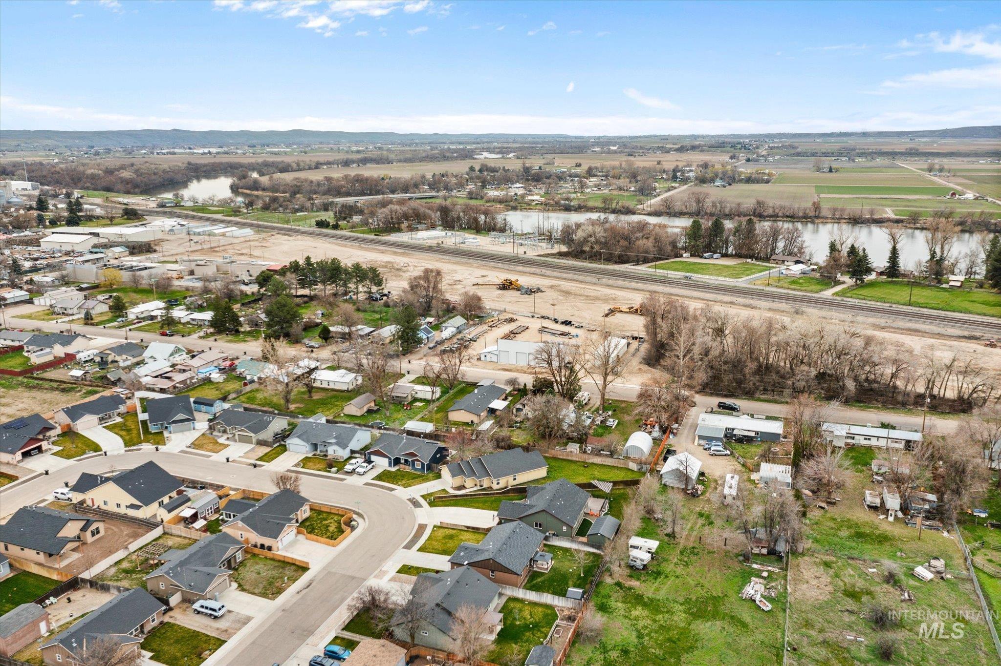 1065 West 11th Street Weiser, ID 83672 - Photo 3 of 48 Aerial perspective of suburban area with a nearby body of water