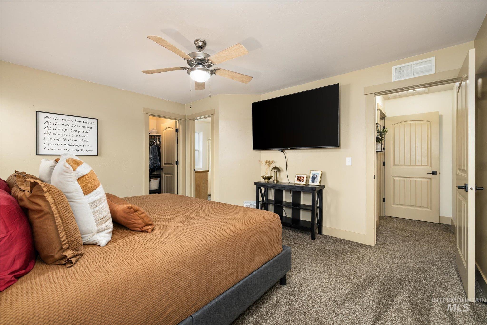1065 West 11th Street Weiser, ID 83672 - Photo 31 of 48 Carpeted bedroom with a walk in closet and a ceiling fan