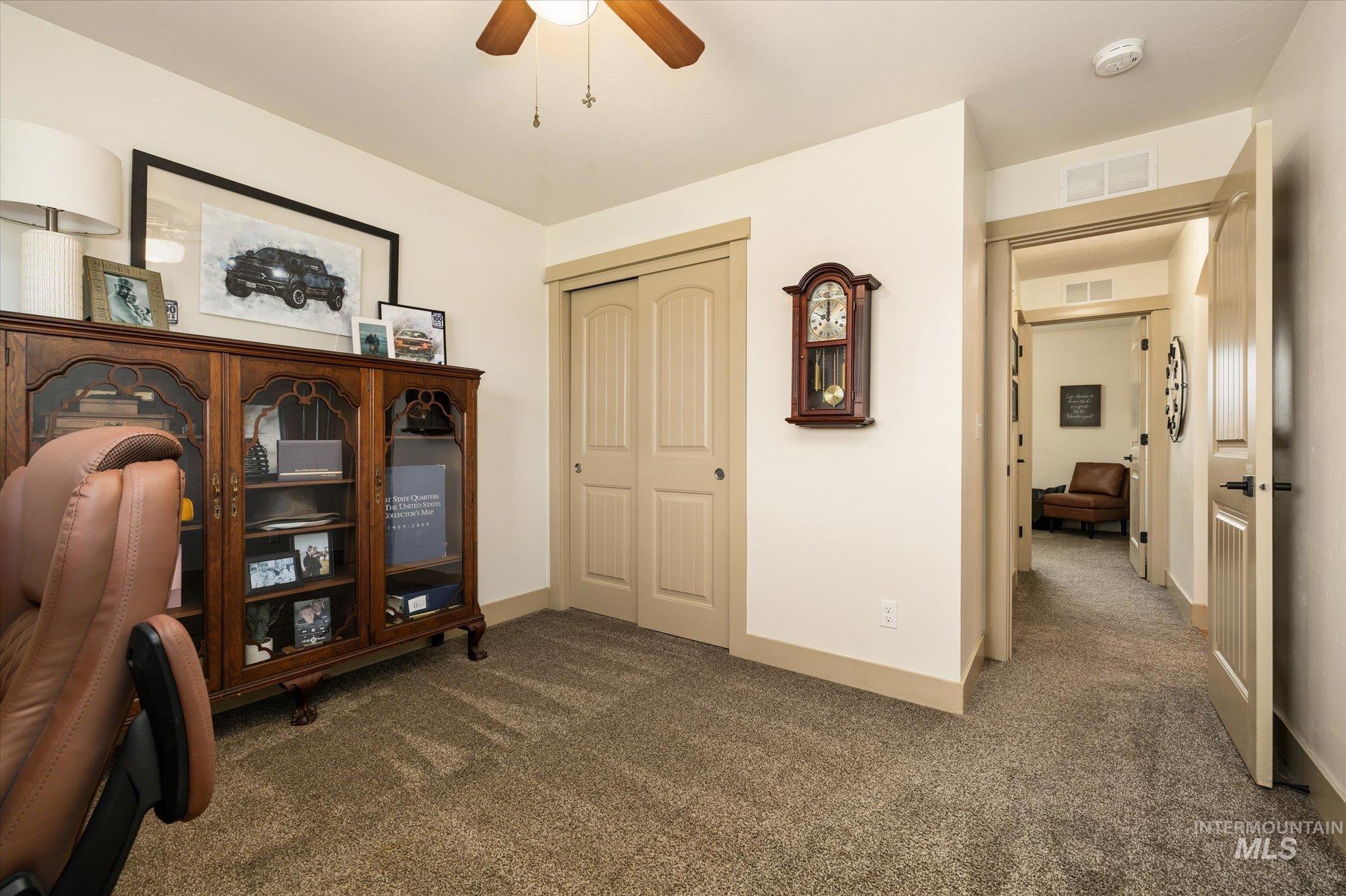1065 West 11th Street Weiser, ID 83672 - Photo 36 of 48 Office area featuring dark colored carpet and a ceiling fan