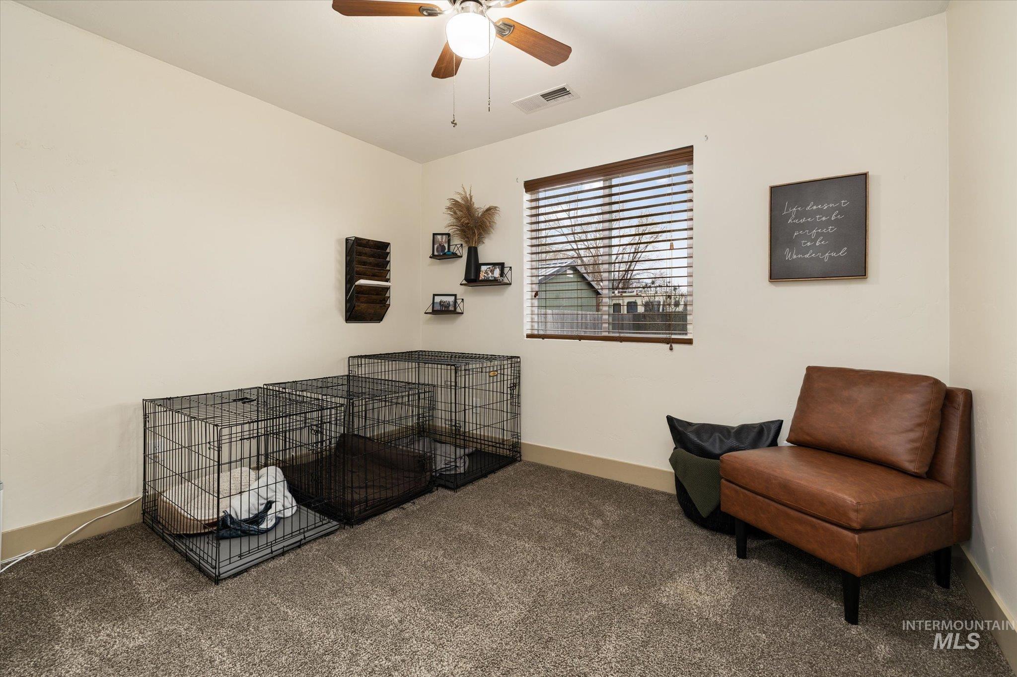 1065 West 11th Street Weiser, ID 83672 - Photo 37 of 48 Sitting room with dark carpet and a ceiling fan