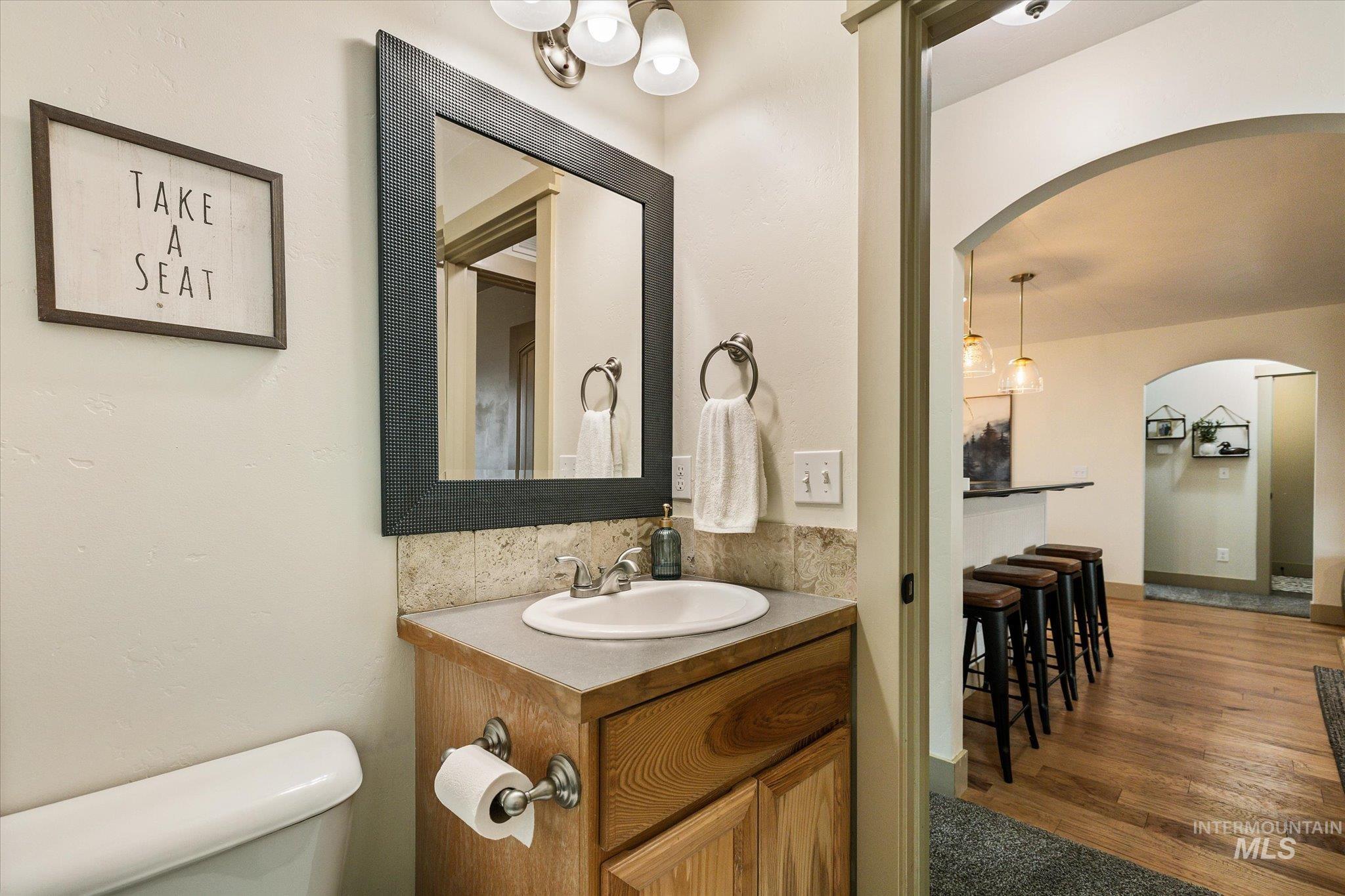 1065 West 11th Street Weiser, ID 83672 - Photo 39 of 48 Bathroom featuring vanity and dark wood-style floors
