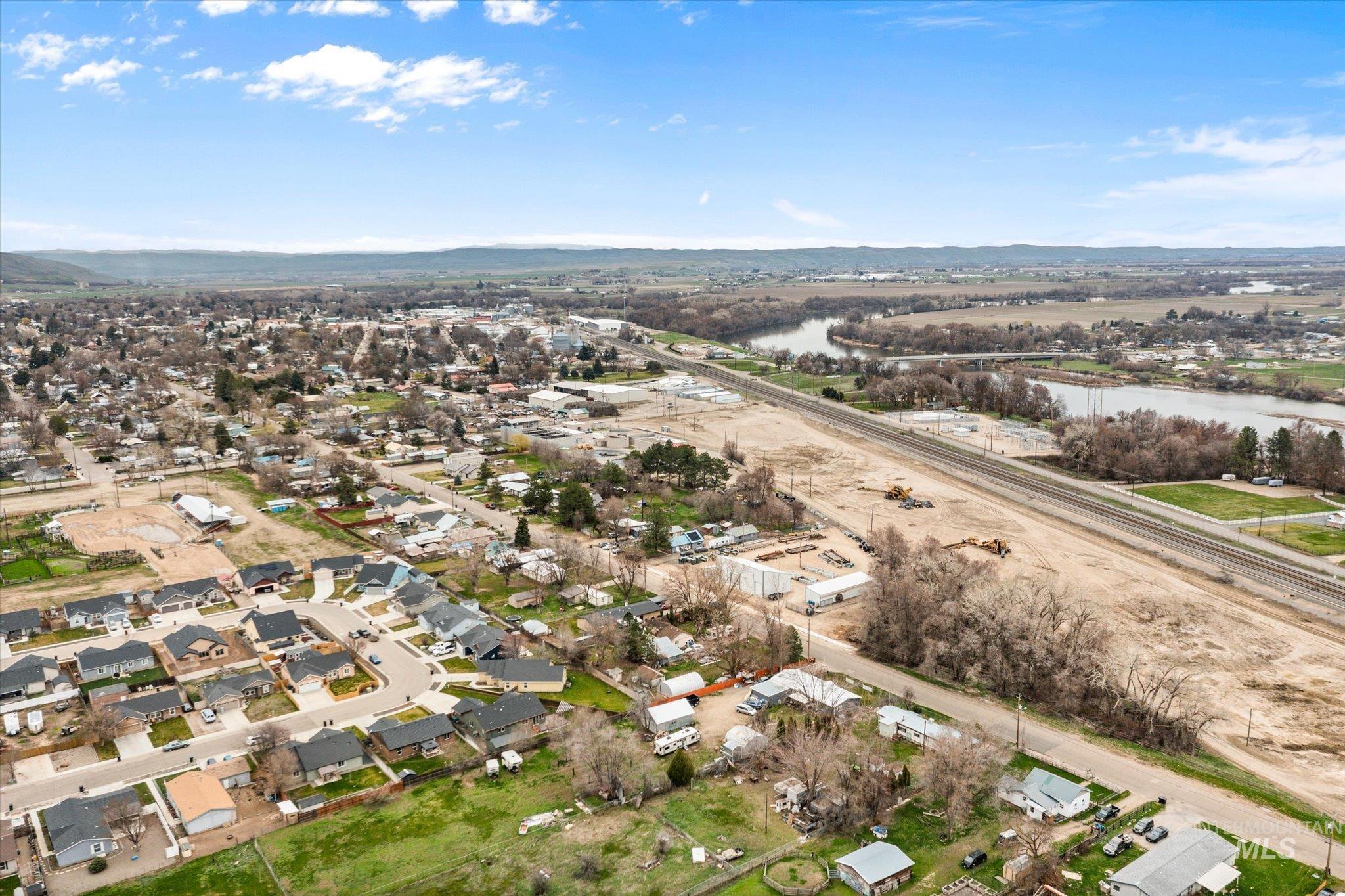 1065 West 11th Street Weiser, ID 83672 - Photo 44 of 48 Aerial perspective of suburban area featuring a water and mountain view