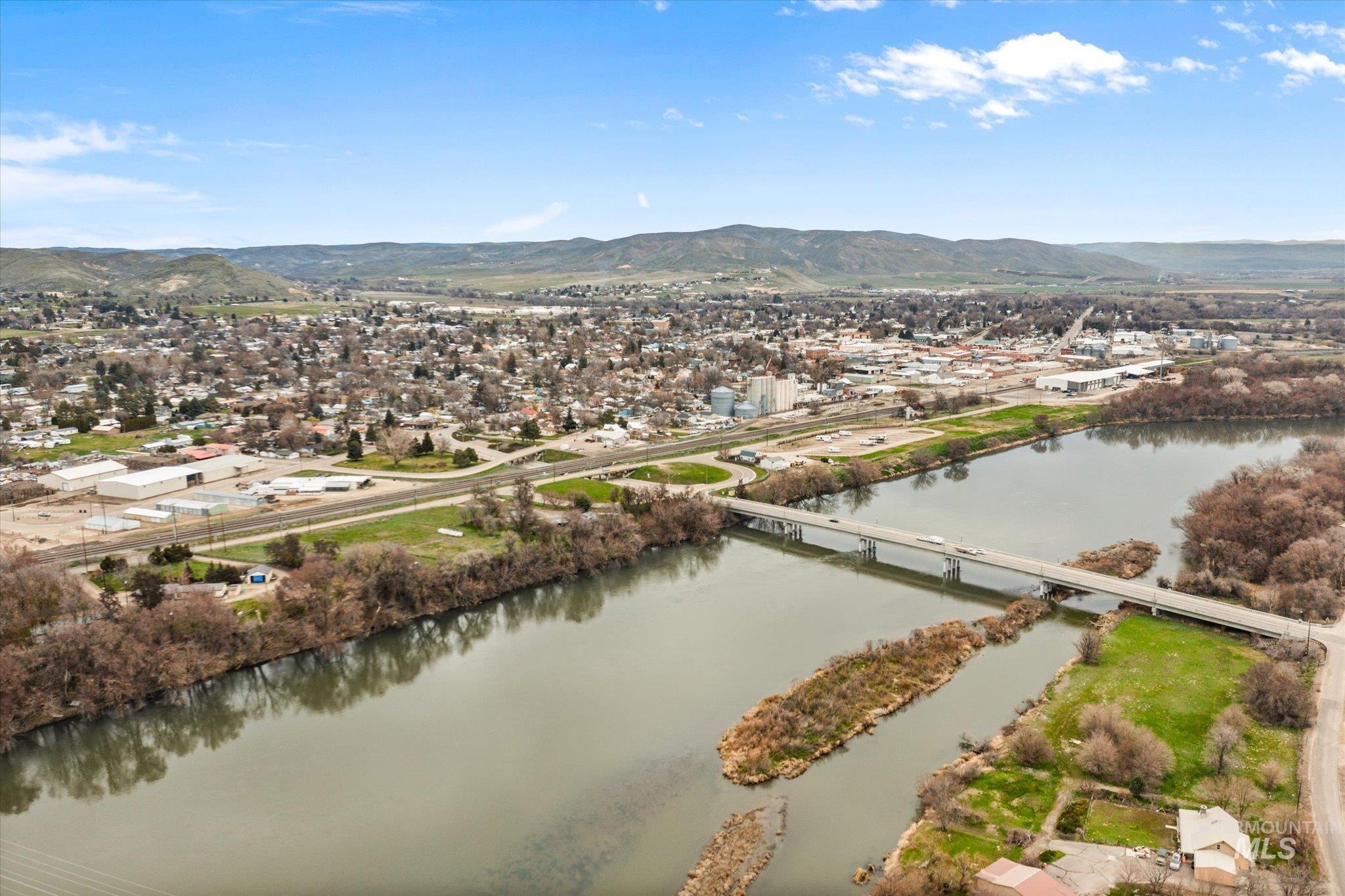 1065 West 11th Street Weiser, ID 83672 - Photo 45 of 48 Aerial view of residential area featuring a notable bridge and a water and mountain view