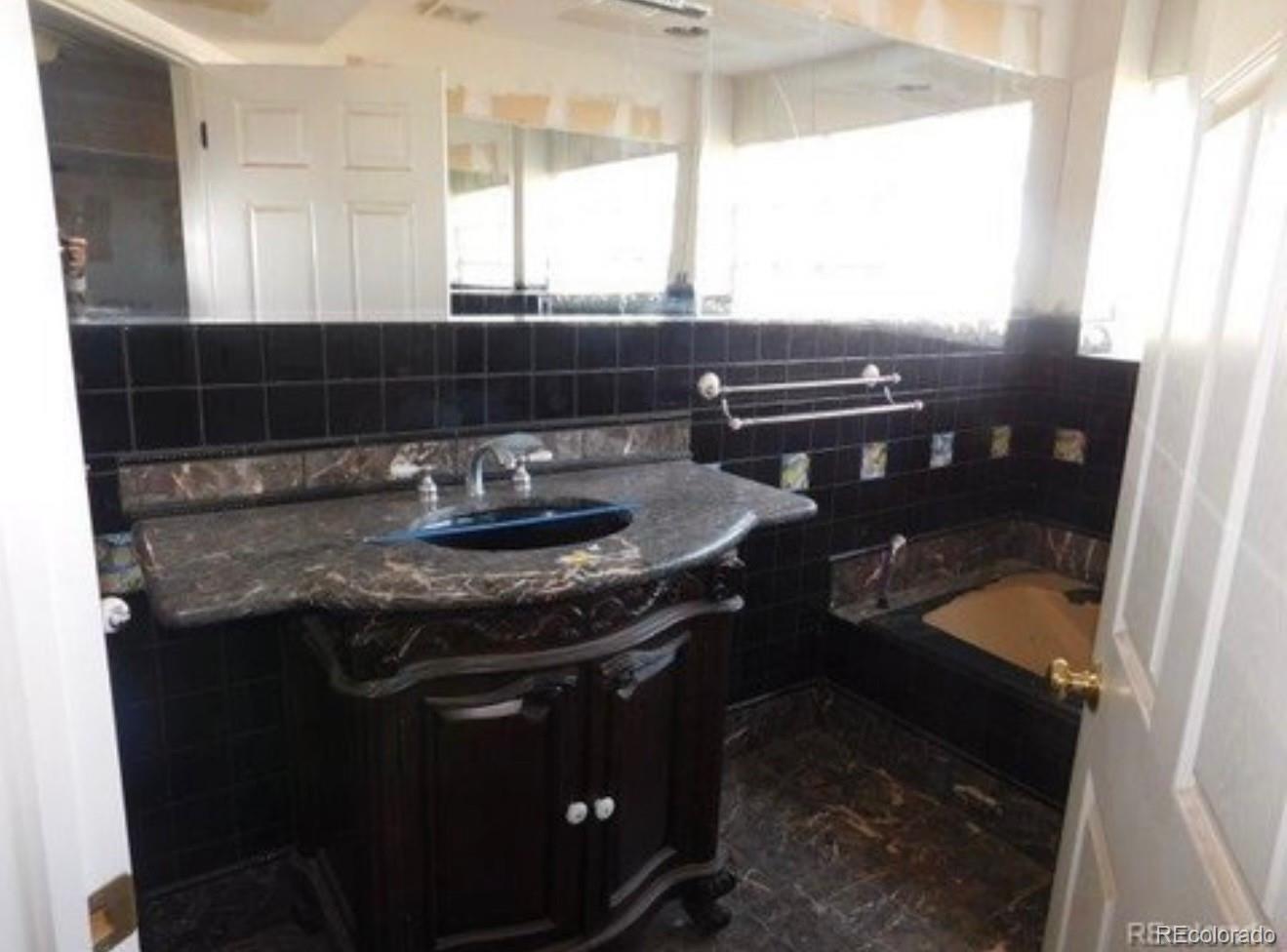 38423 County Road 166 Agate, CO 80101 - Photo 14 of 28 a kitchen with a sink a window and cabinets