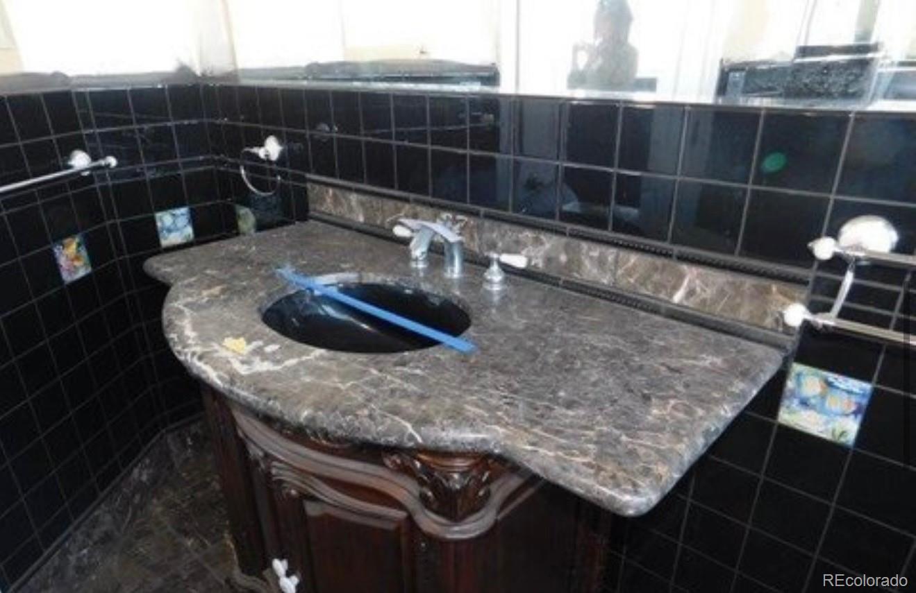 38423 County Road 166 Agate, CO 80101 - Photo 15 of 28 a bathroom with a sink and a mirror