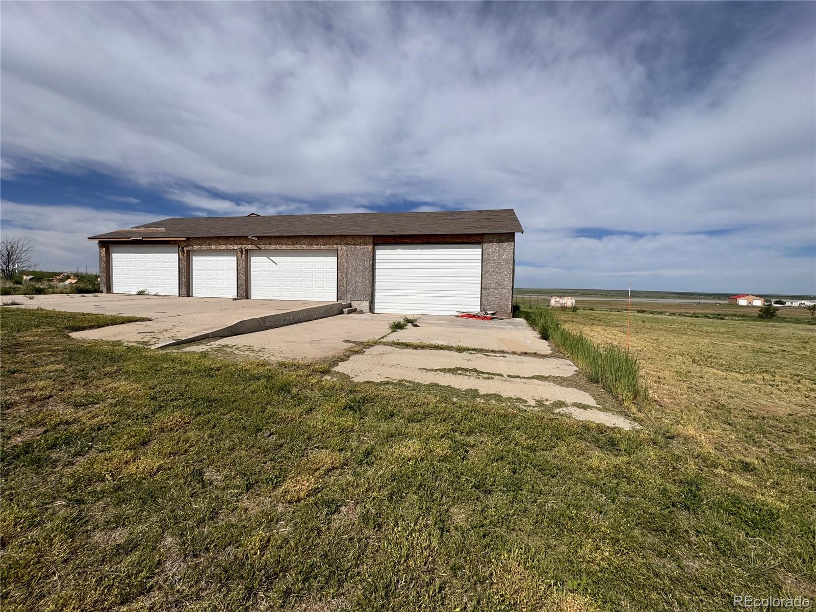 38423 County Road 166 Agate, CO 80101 - Photo 3 of 28 a bedroom with a bed and a night stand
