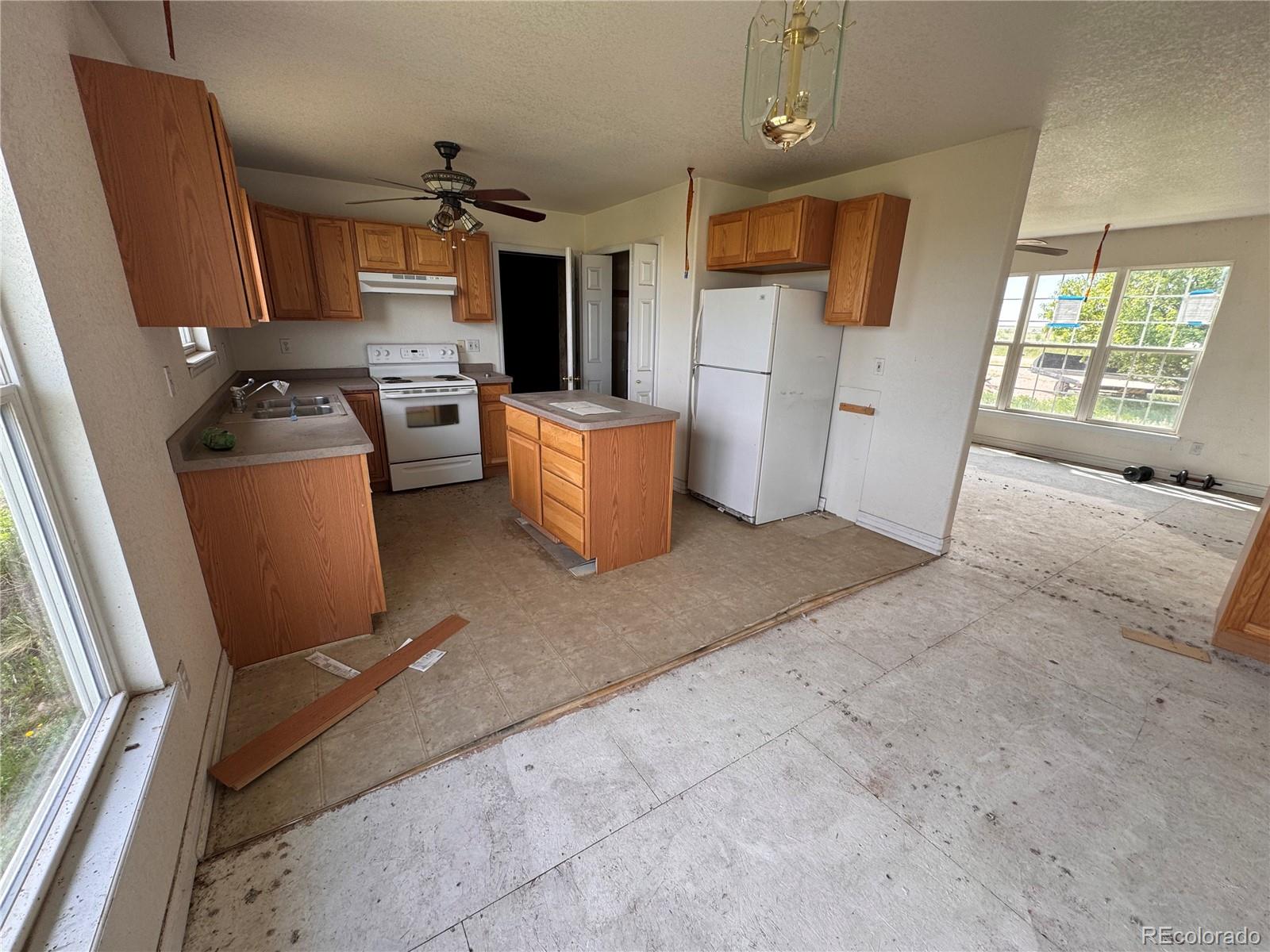 38423 County Road 166 Agate, CO 80101 - Photo 4 of 28 a kitchen with stainless steel appliances a refrigerator and a stove top oven