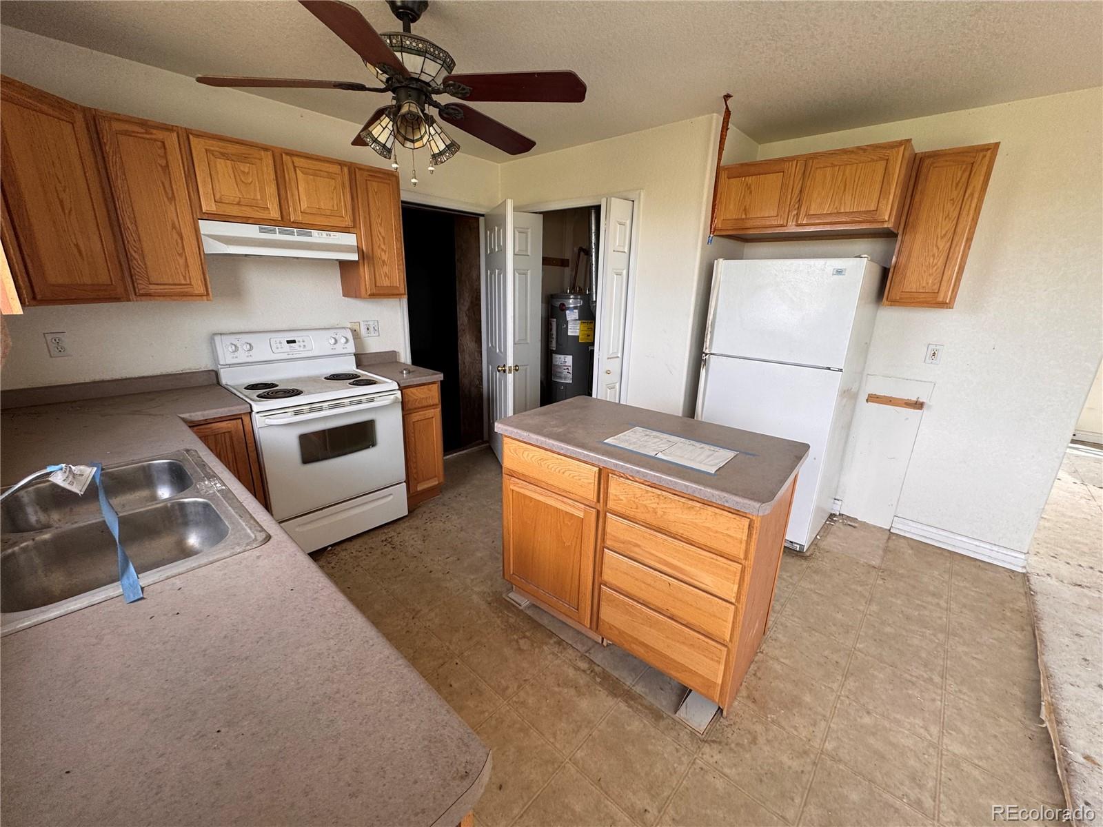 38423 County Road 166 Agate, CO 80101 - Photo 6 of 28 a kitchen with stainless steel appliances granite countertop a stove a sink dishwasher and a refrigerator