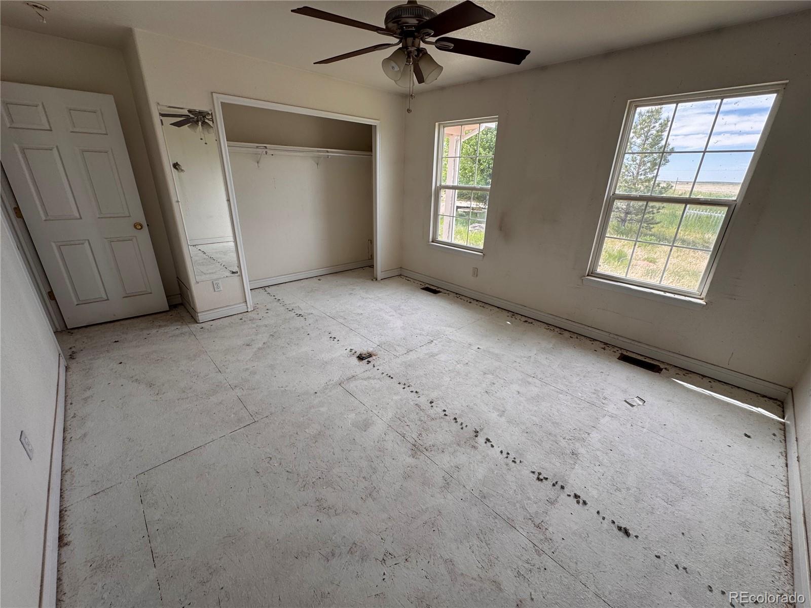 38423 County Road 166 Agate, CO 80101 - Photo 8 of 28 an empty room with windows and closet