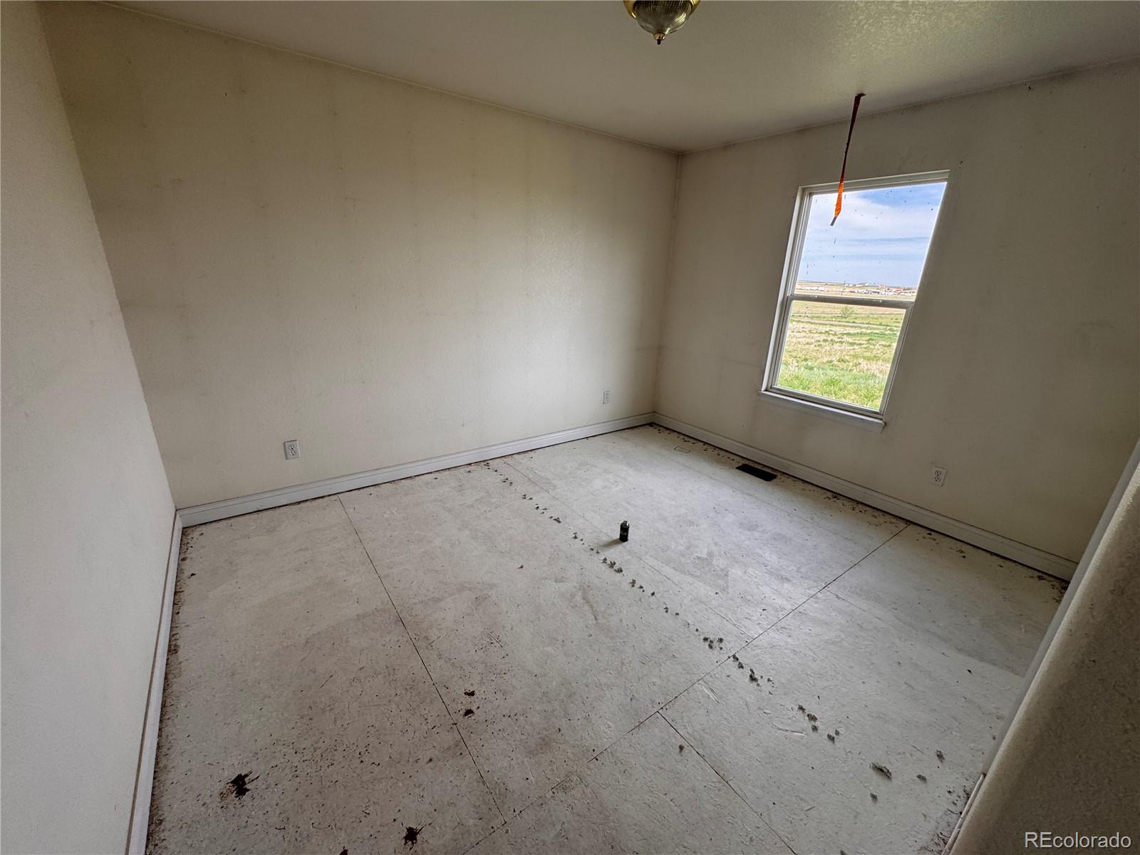 38423 County Road 166 Agate, CO 80101 - Photo 9 of 28 a view of an empty room with a window