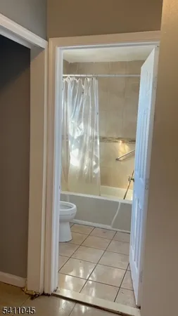 a bathroom with a glass shower door