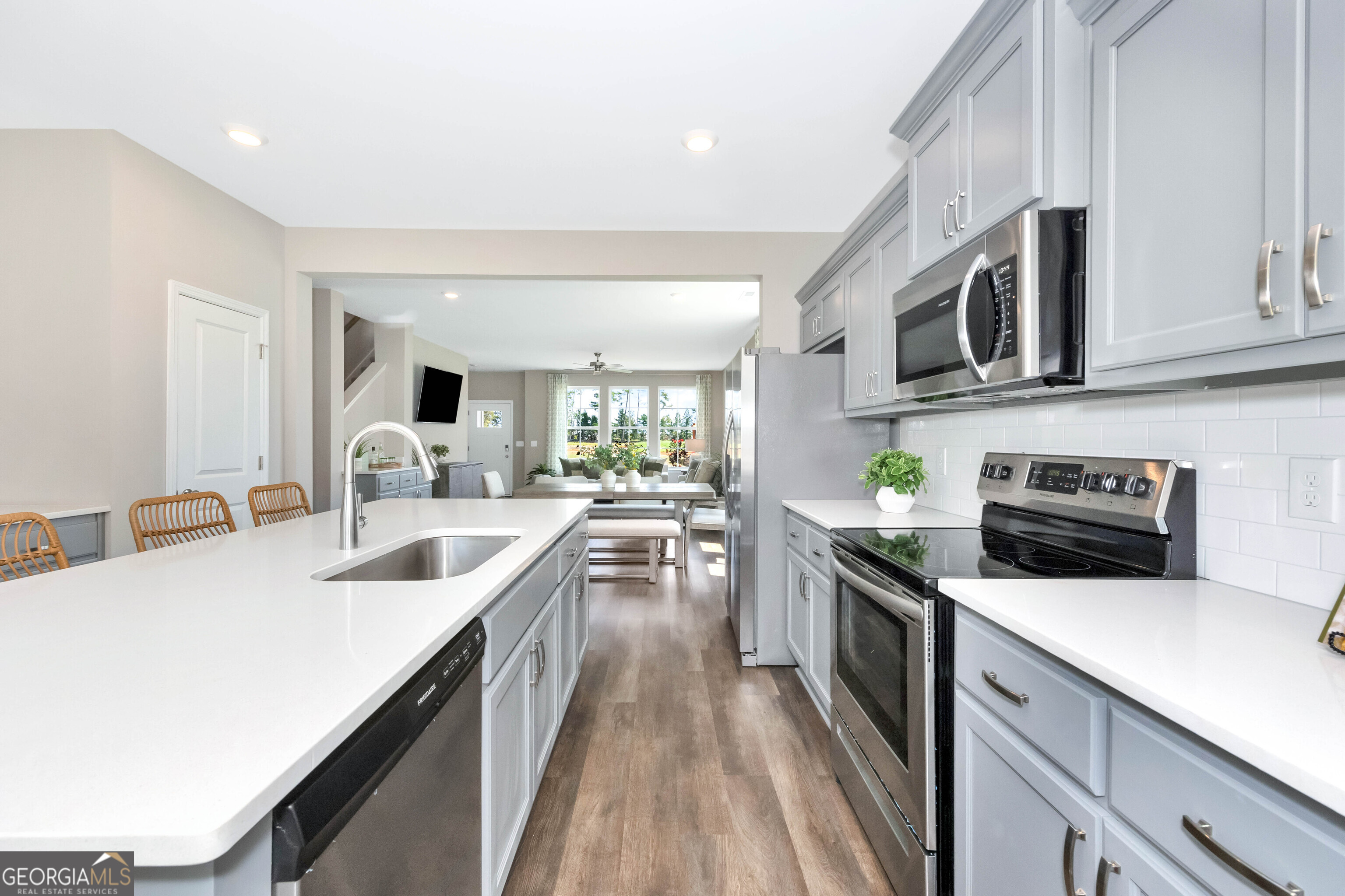 200 Ivy Glen Drive Perry, GA 31069 - Photo 6 of 13 a kitchen with counter top space a sink and appliances