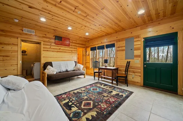 a bedroom with furniture and a window