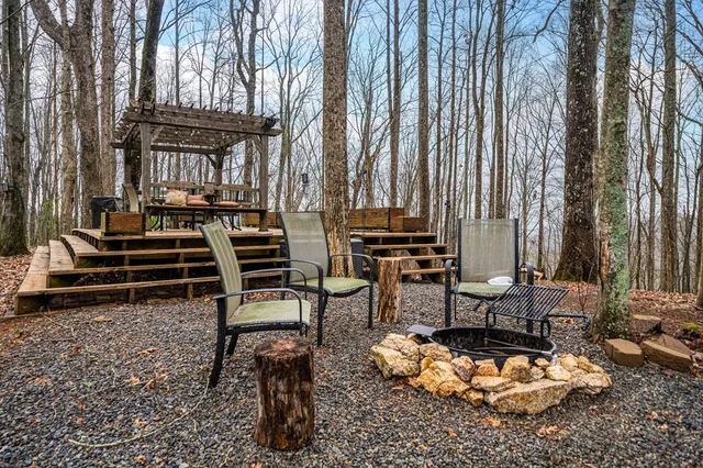 a view of a chairs and table on the deck