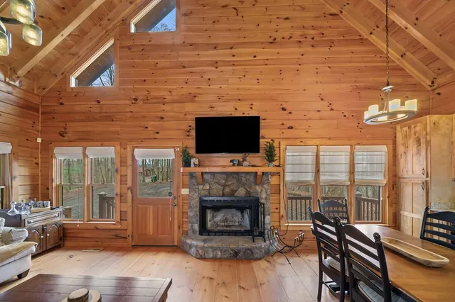 a living room with fireplace furniture and a flat screen tv