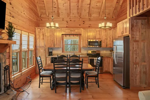 a view of a dining room with furniture window and outside view