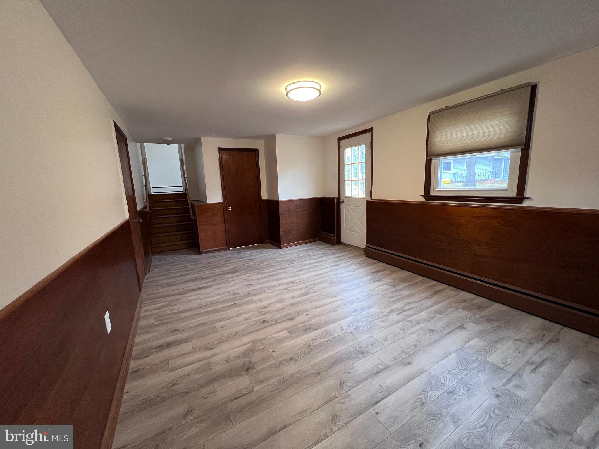 155 Sillery Bay Road Pasadena, MD 21122 - Photo 24 of 34 wooden floor in an empty room with a window