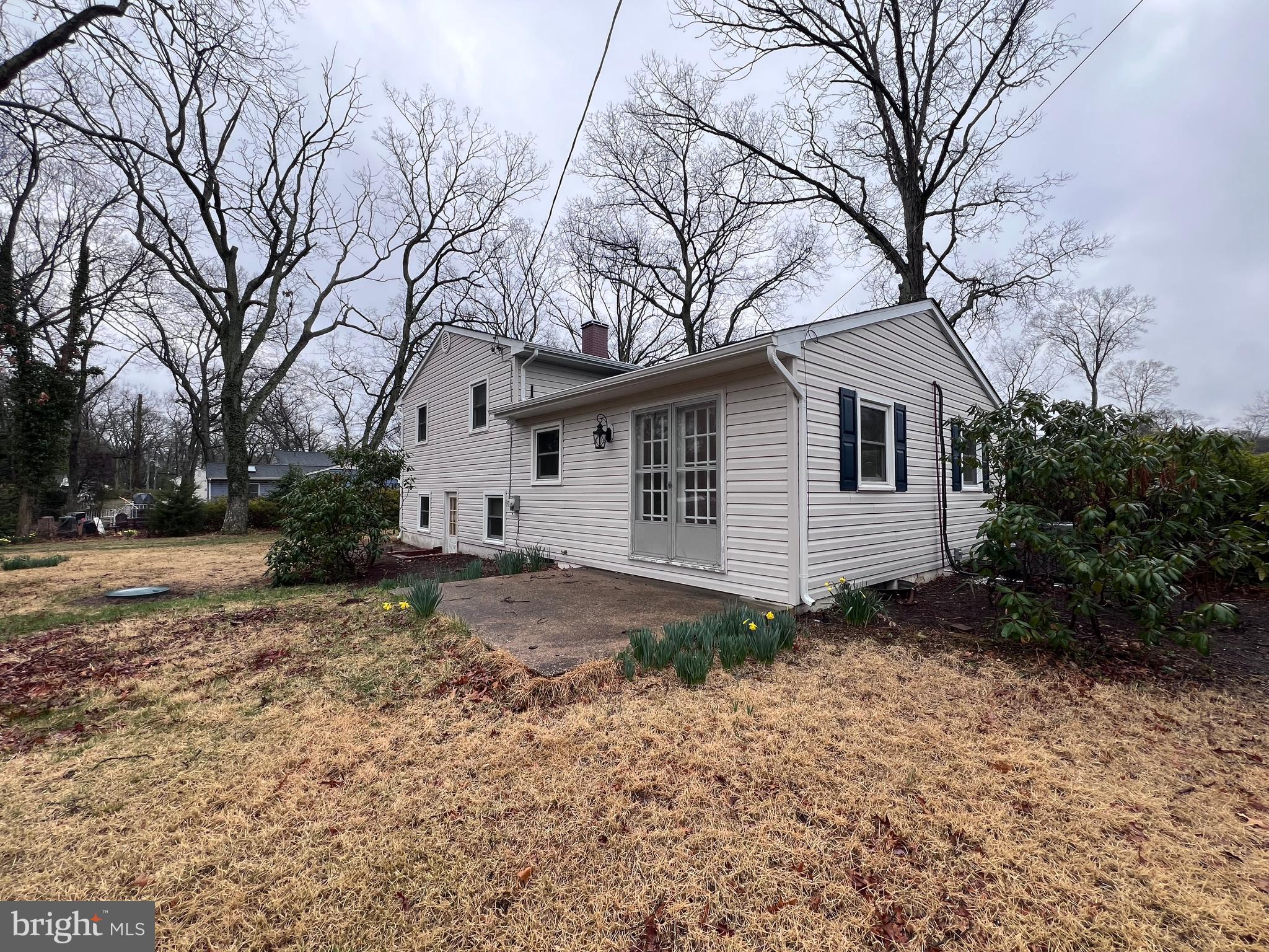 155 Sillery Bay Road Pasadena, MD 21122 - Photo 27 of 34 a view of a house with a yard covered in snow