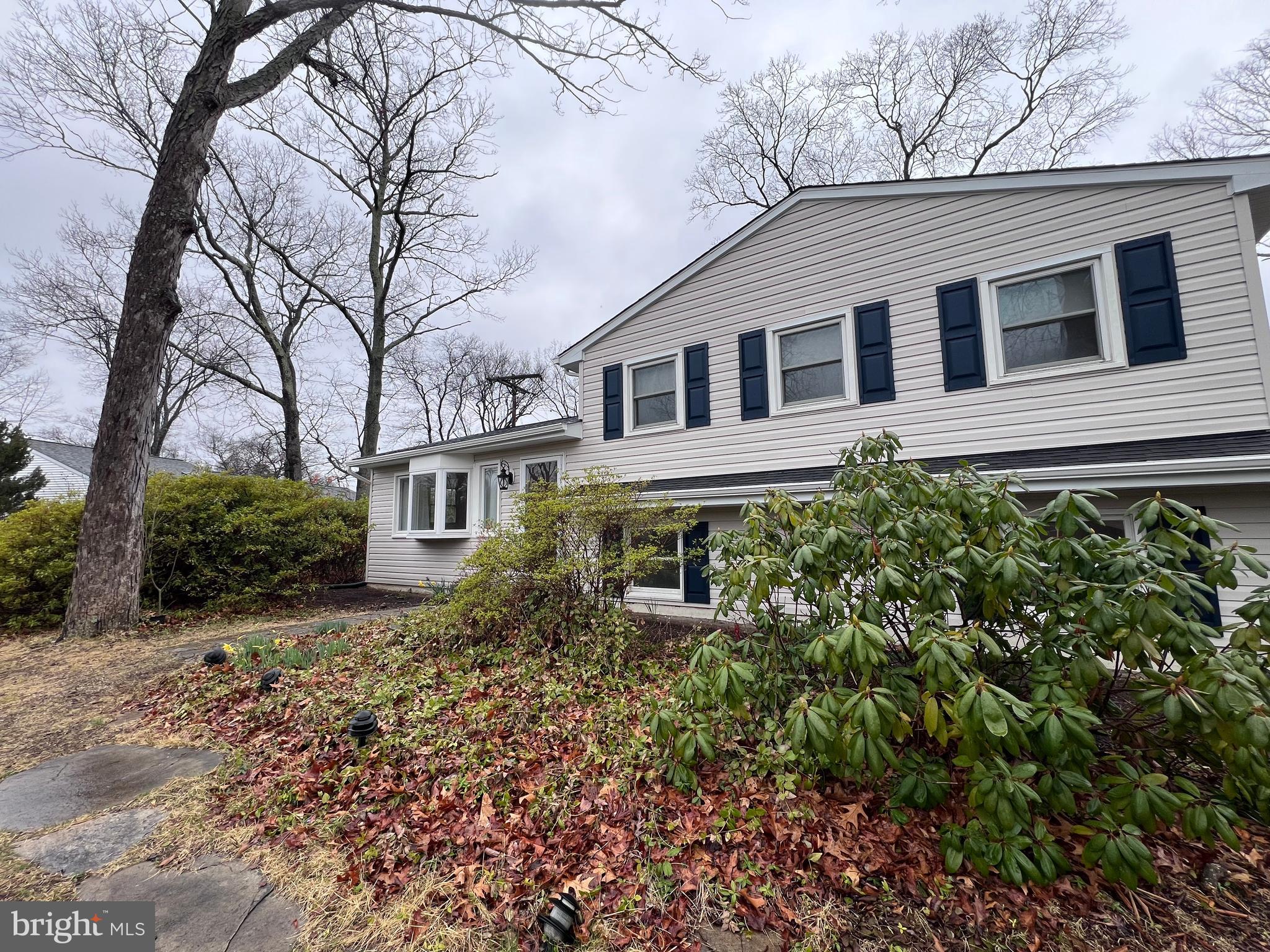 155 Sillery Bay Road Pasadena, MD 21122 - Photo 28 of 34 a front view of a house with a garden