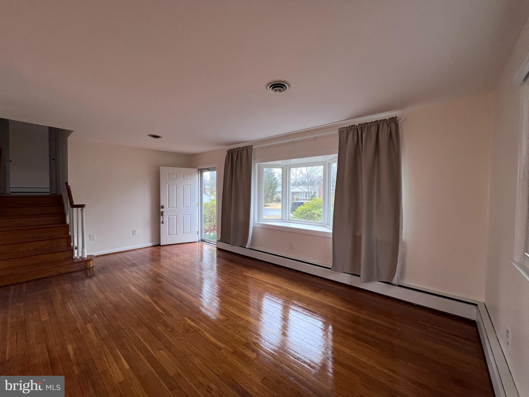 155 Sillery Bay Road Pasadena, MD 21122 - Photo 5 of 34 a view of empty room with wooden floor and fan