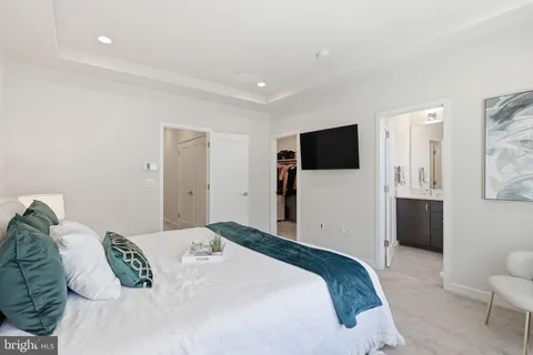 a bathroom with a shower sink and mirror