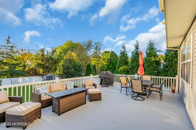 a view of a patio with a table and chairs
