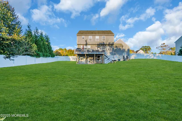 a view of a garden with a building in the background