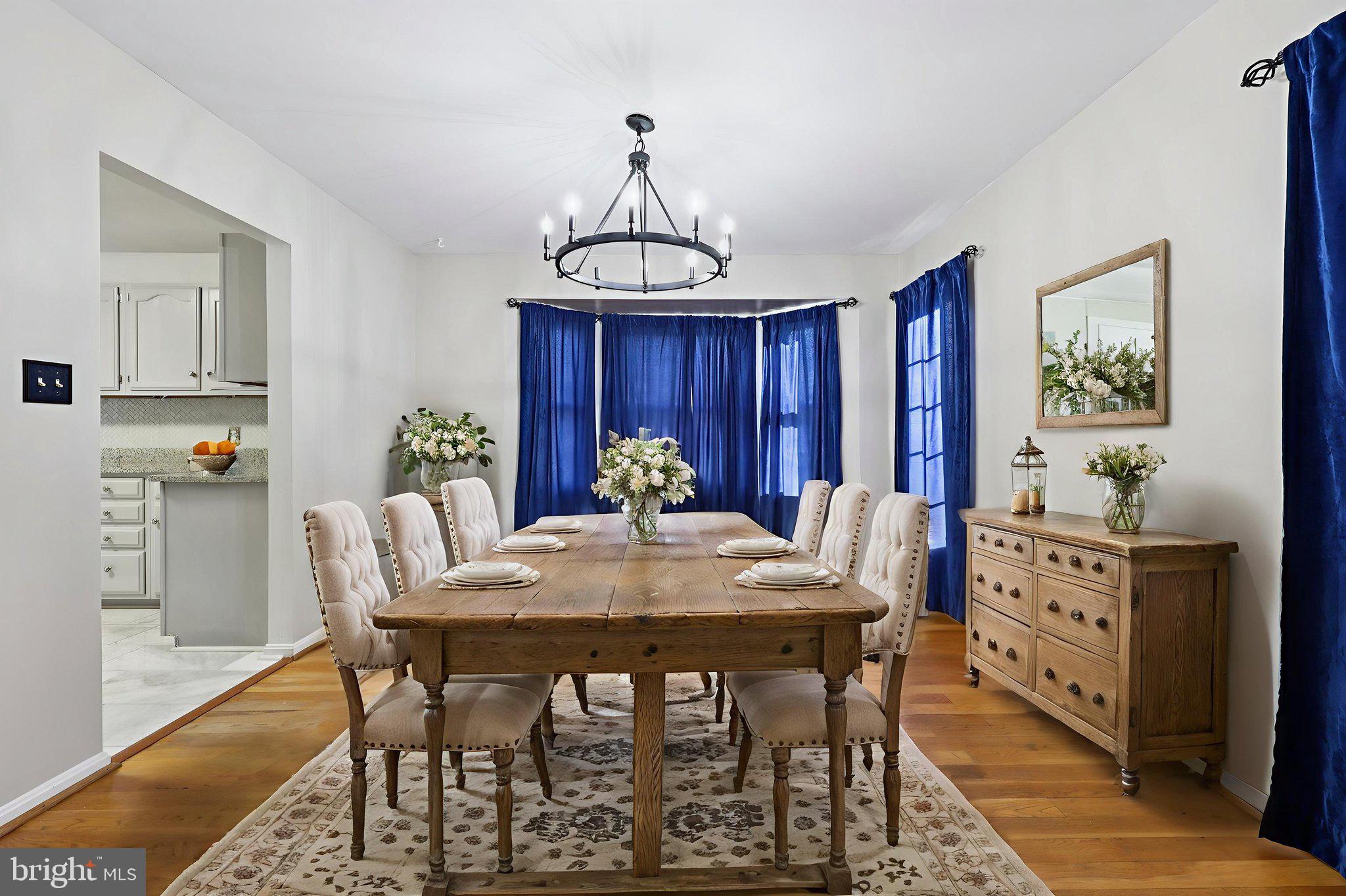 13445 Blackwells Mill Road Goldvein, VA 22720 - Photo 19 of 95 a view of a dining room with furniture window and wooden floor