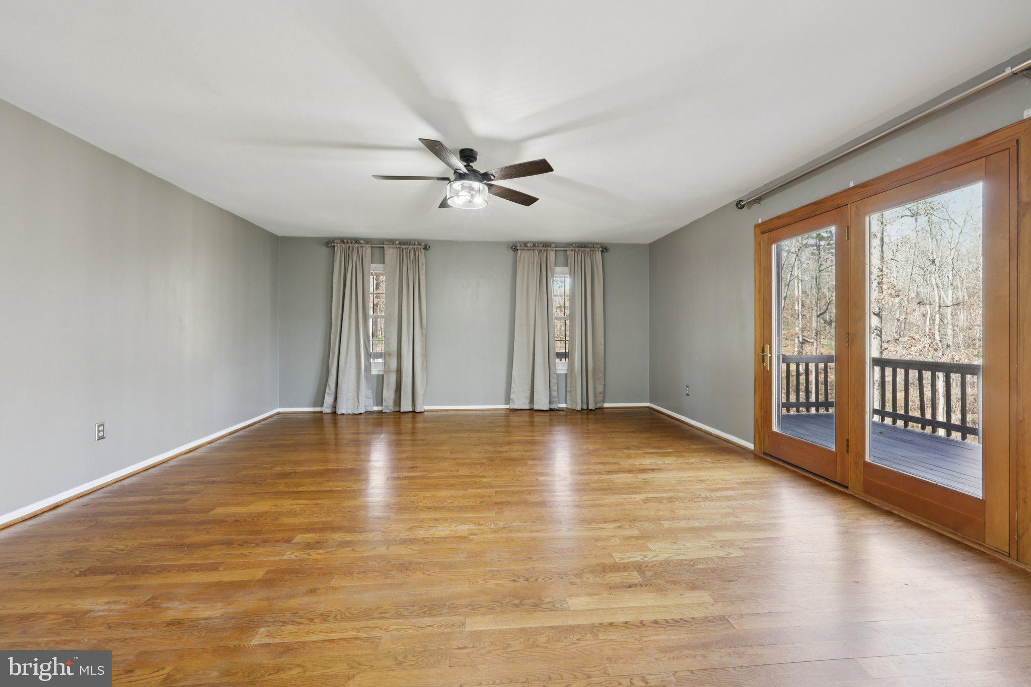 13445 Blackwells Mill Road Goldvein, VA 22720 - Photo 28 of 95 a view of an empty room with window and wooden floor