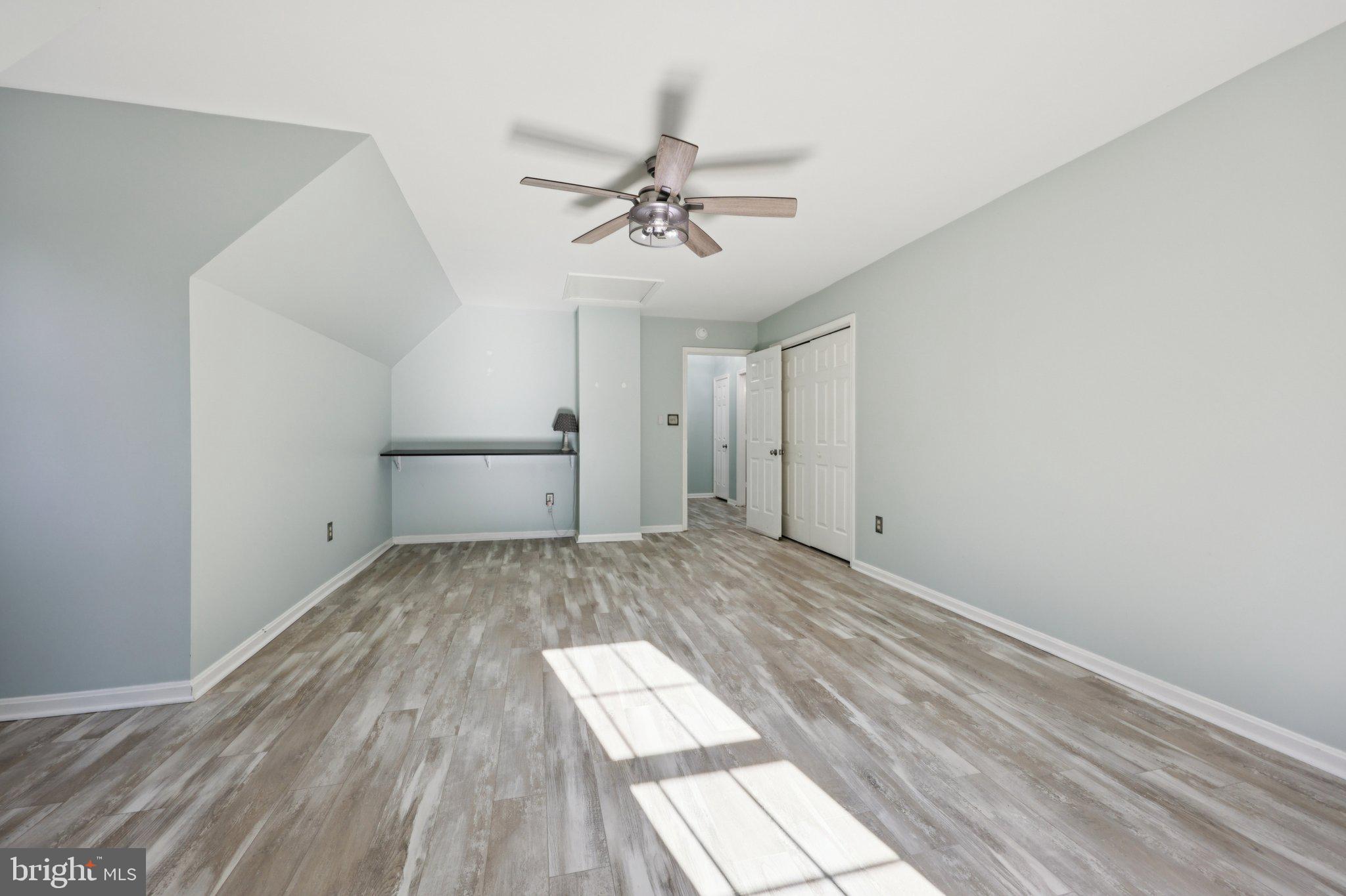 13445 Blackwells Mill Road Goldvein, VA 22720 - Photo 45 of 95 a view of empty room with wooden floor and fan