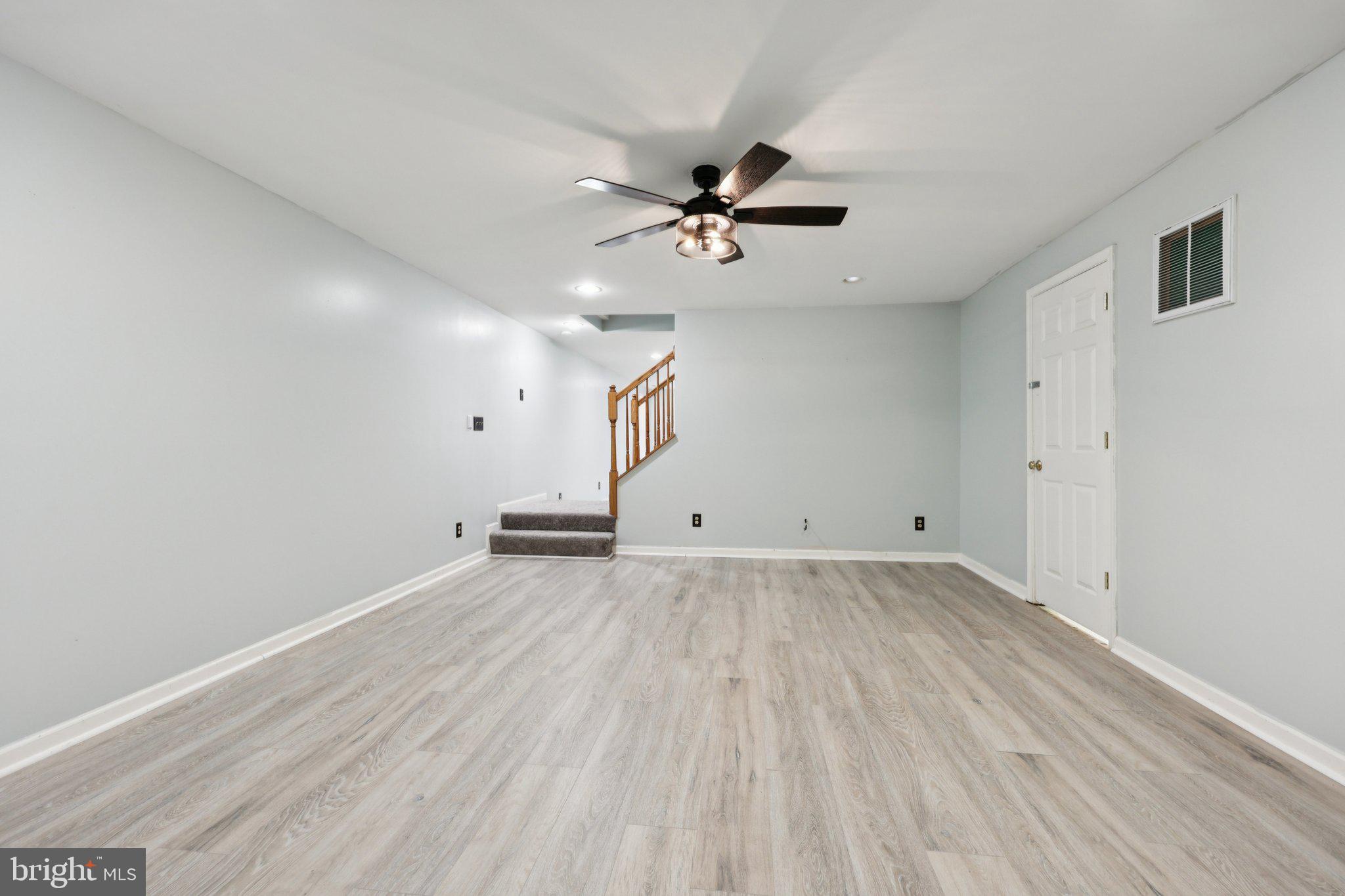 13445 Blackwells Mill Road Goldvein, VA 22720 - Photo 55 of 95 an empty room with wooden floor and windows