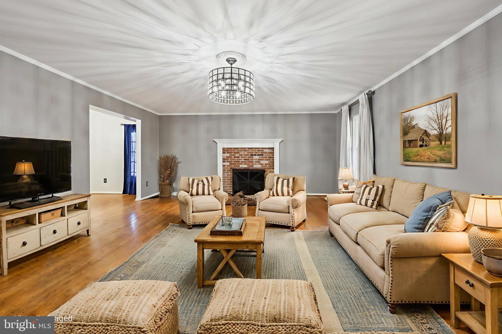 13445 Blackwells Mill Road Goldvein, VA 22720 - Photo 6 of 95 a living room with furniture and a flat screen tv