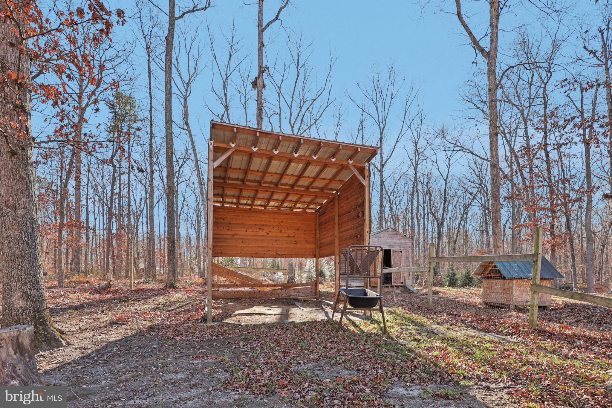 13445 Blackwells Mill Road Goldvein, VA 22720 - Photo 69 of 95 a view of a bench in a backyard