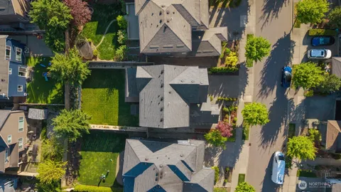an aerial view of a house with a yard and garden