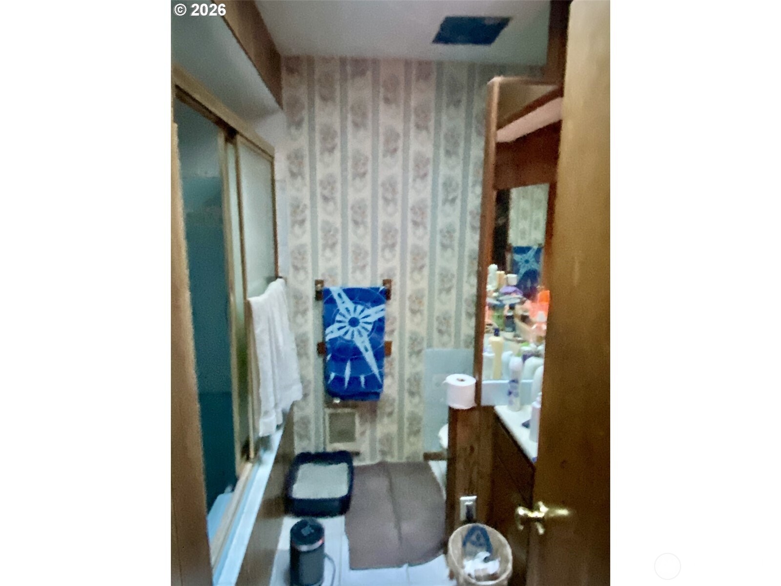 101 Northwest 107th Street Vancouver, WA 98685 - Photo 11 of 27 a bathroom with a toilet and a shower curtain