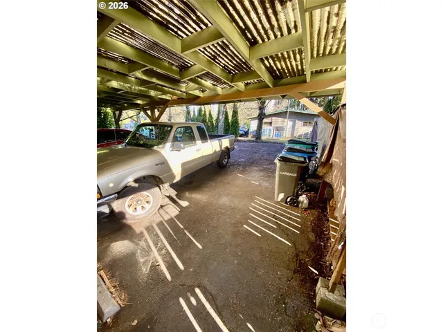 a view of a car in front of a house