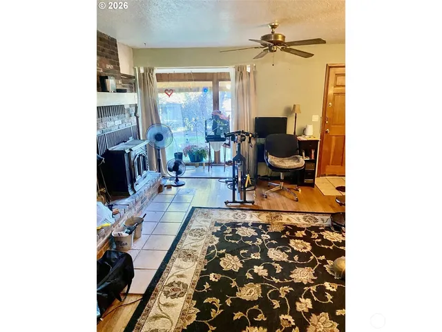 a living room with furniture and a rug