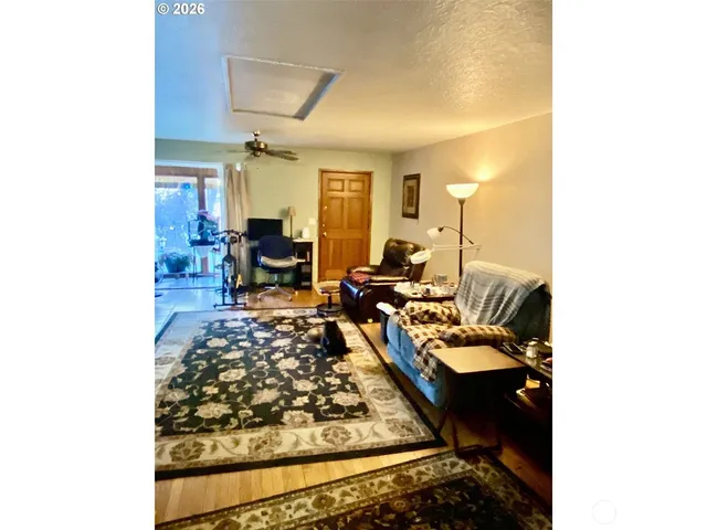 a living room with furniture and a table