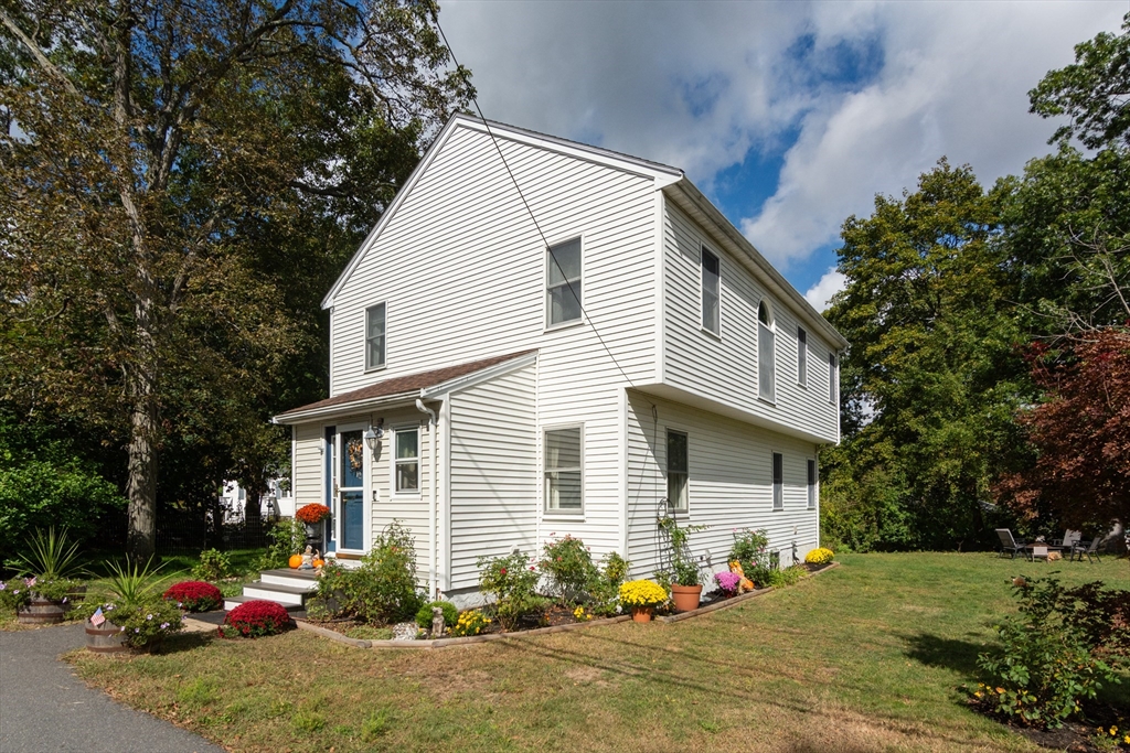 a front view of a house with a yard