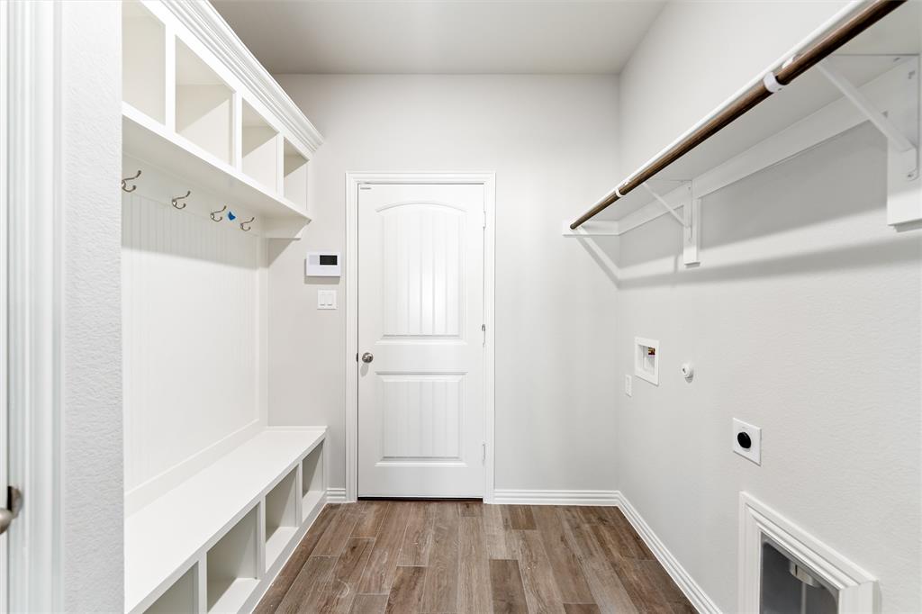 541 Mitchell Boulevard Weatherford, TX 76087 - Photo 21 of 30 a view of hallway with wooden floor