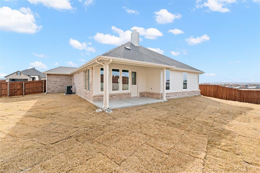 541 Mitchell Boulevard Weatherford, TX 76087 - Photo 24 of 30 a view of a house with a yard