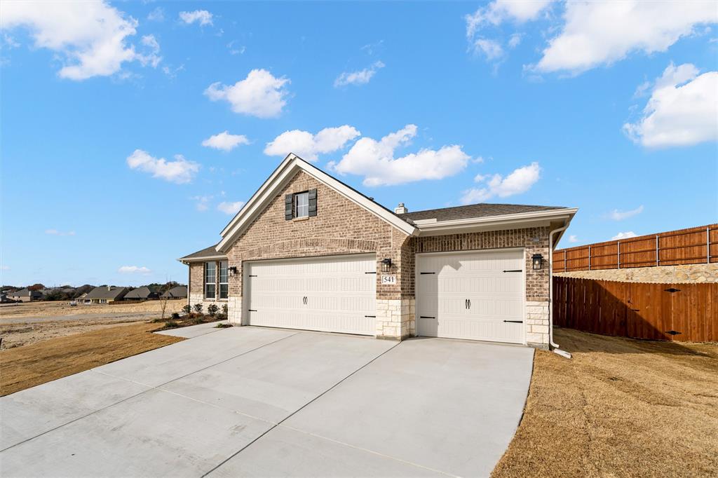 541 Mitchell Boulevard Weatherford, TX 76087 - Photo 28 of 30 a view of garage and utility room